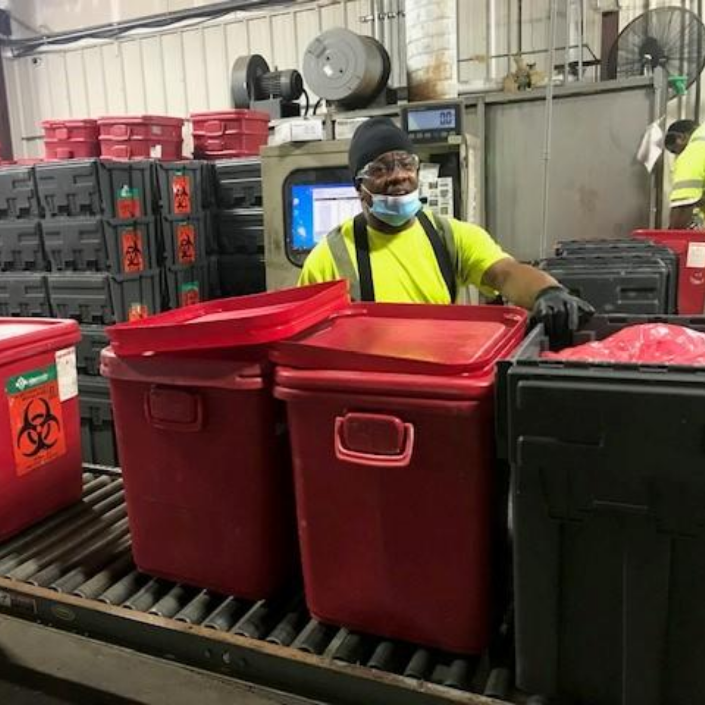 Photo of Stericycle staff member on-the-job at indoor facility 