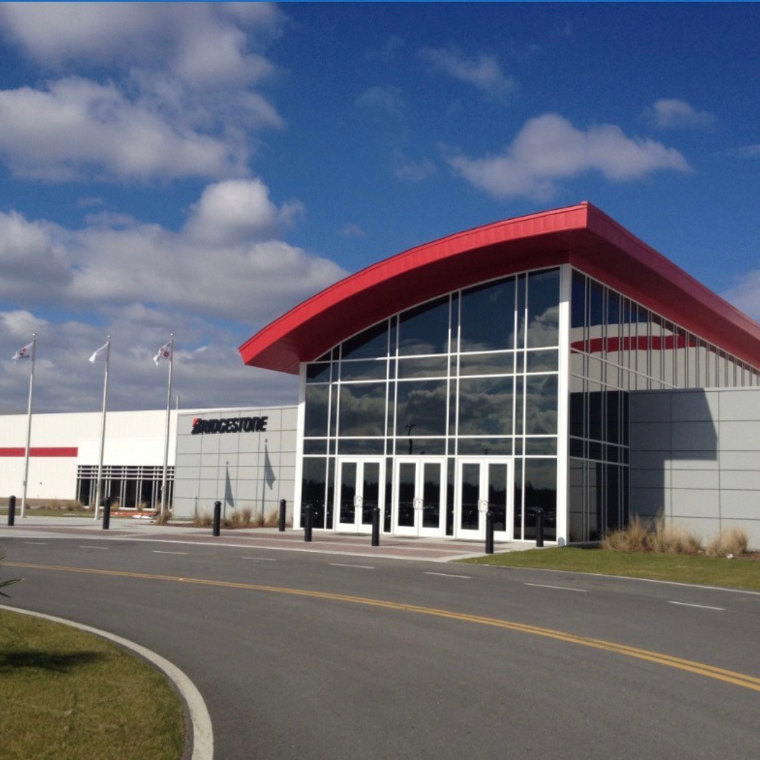 The image depicts Bridgestone from the outside, a picture of the front of the building and entrance