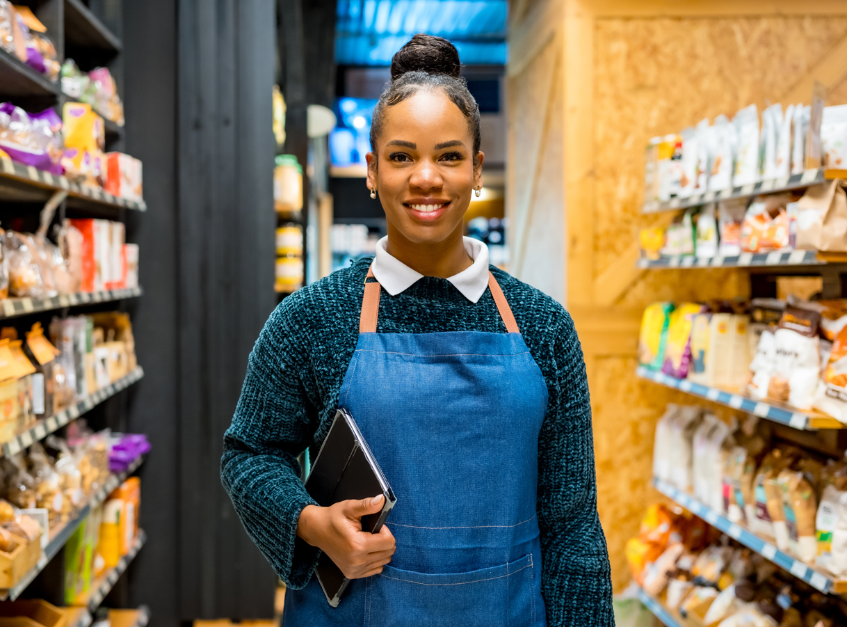 Retail manager holding tablet.