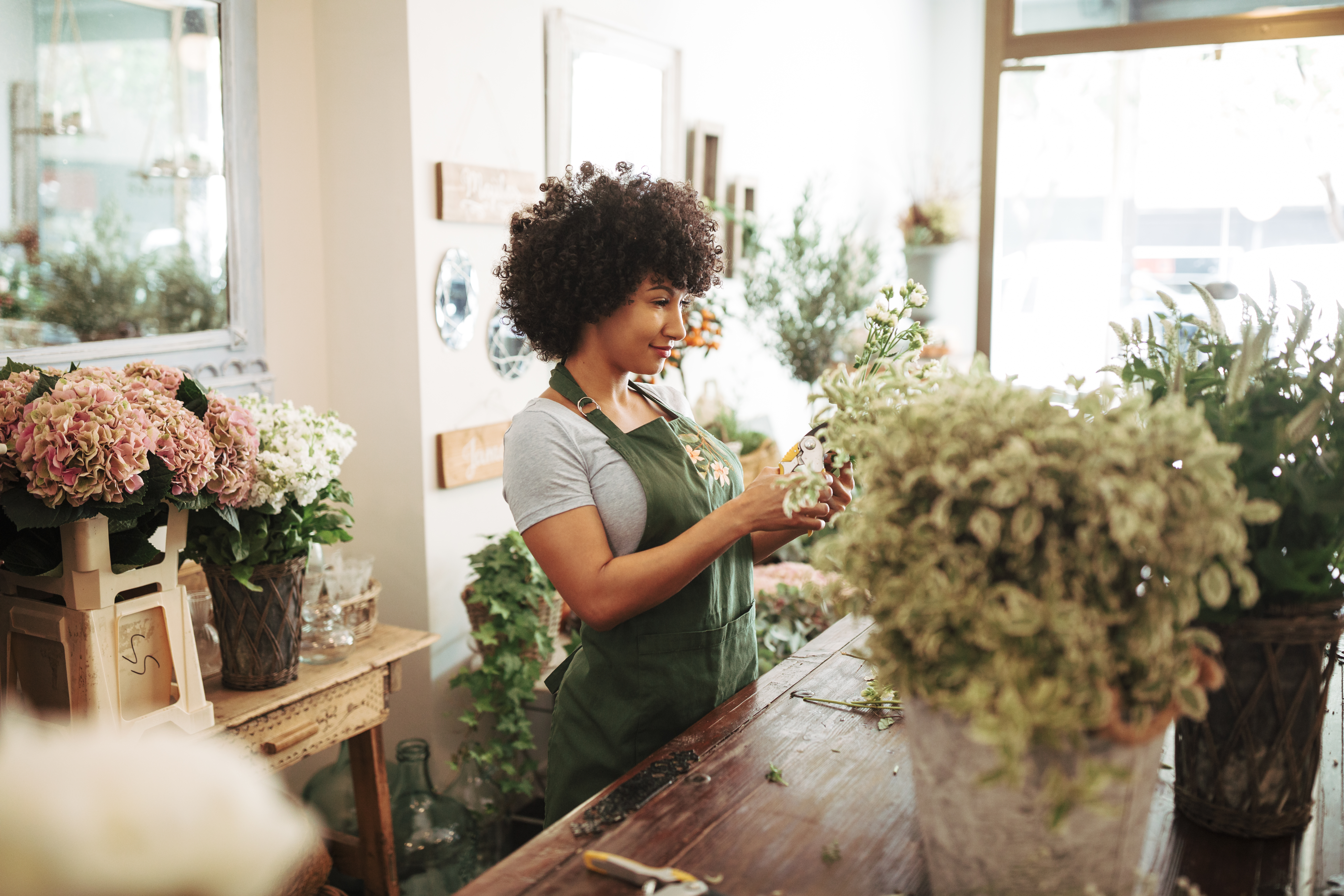 woman arranges flowers